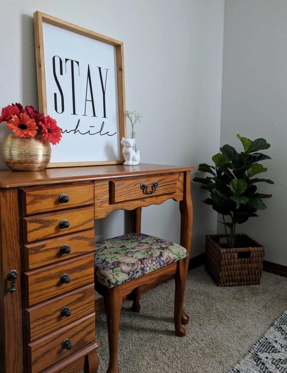 jewelry armoire in a farmhouse bedroom