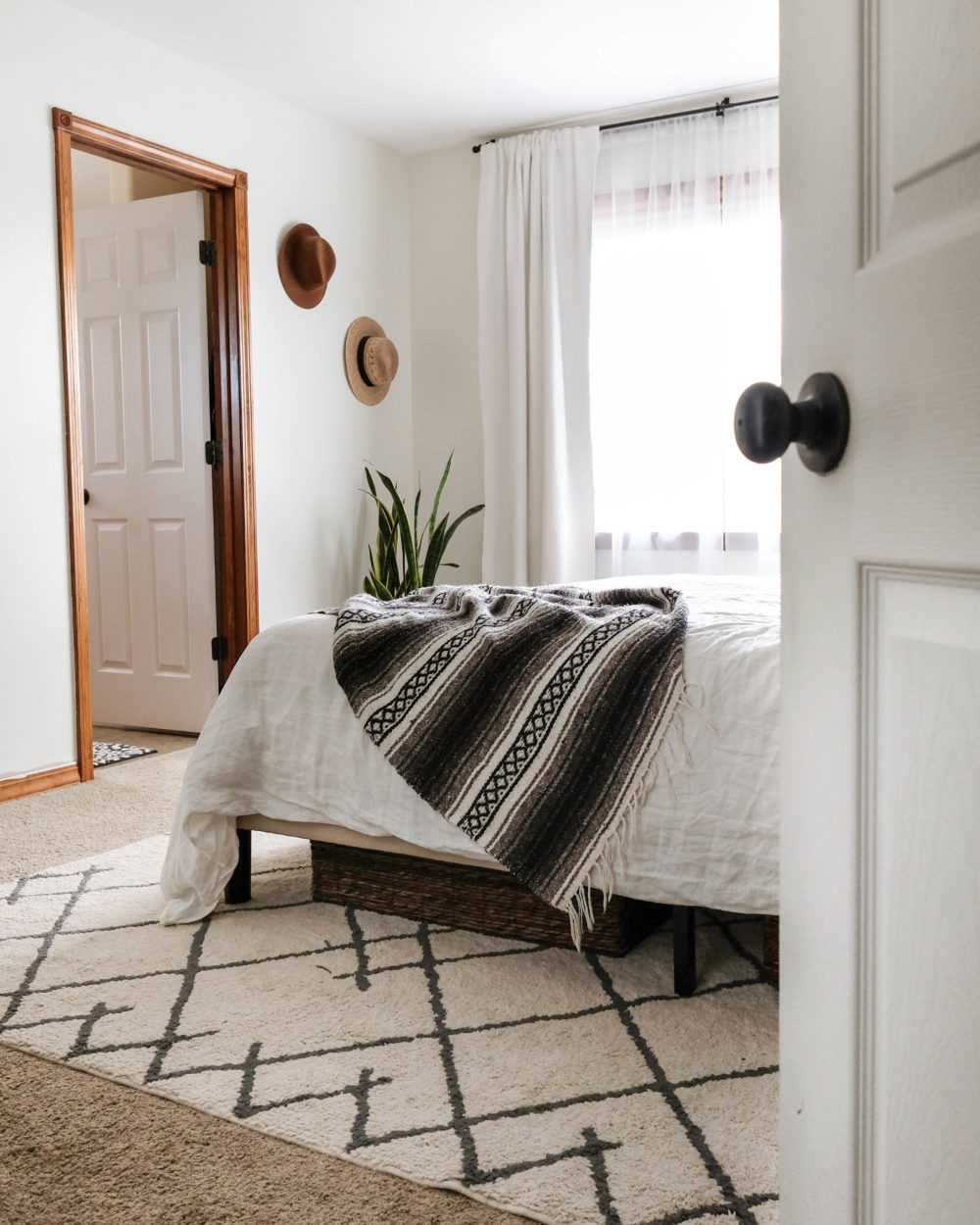 a master bedroom painted with Benjamin Moore White Dove