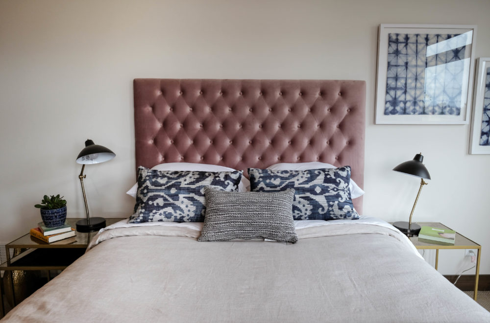 Parade of Homes bedroom with pink headboard, nightstands and lamps