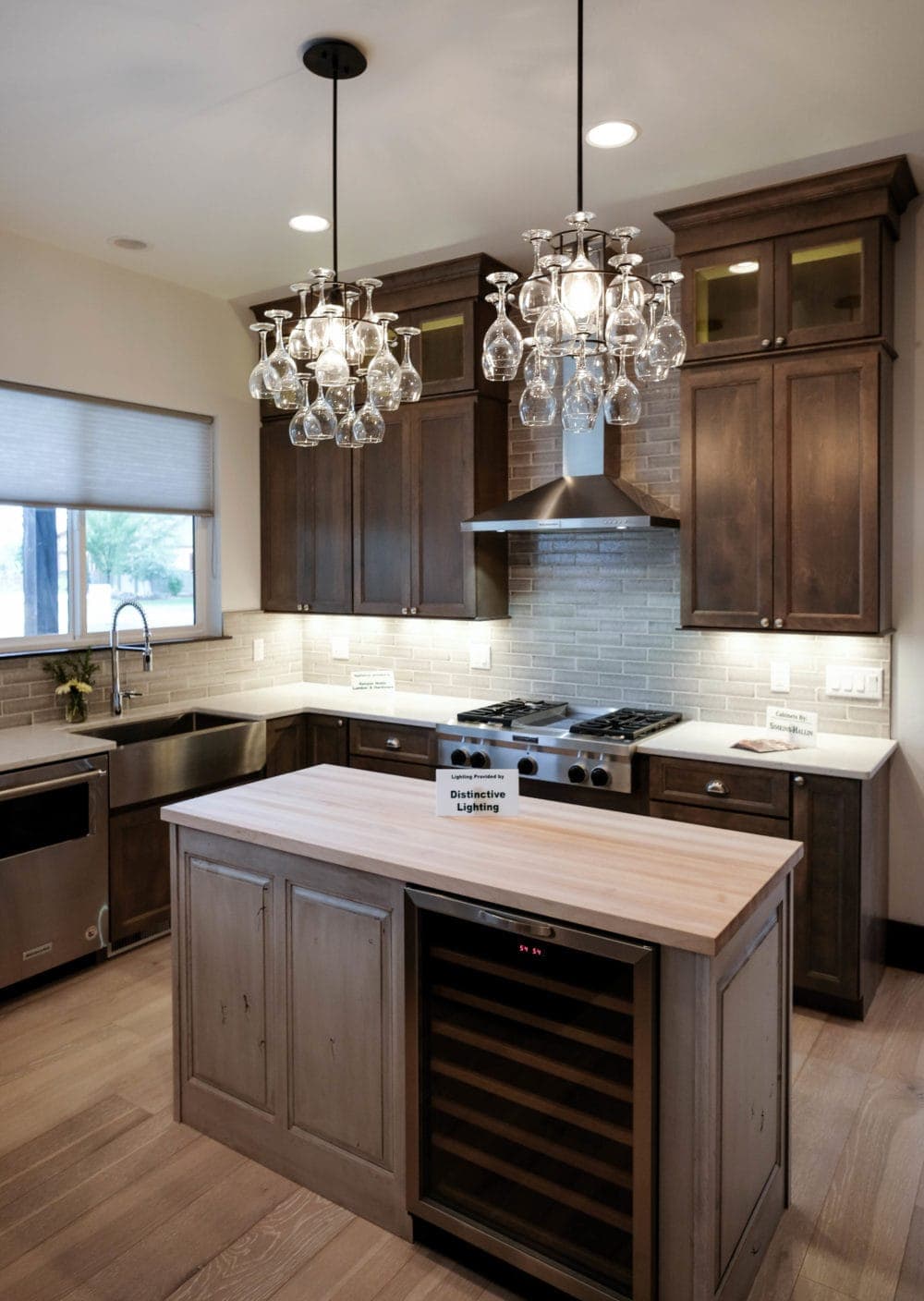 Parade of Homes designer kitchen with dark cabinets, and butcher block island