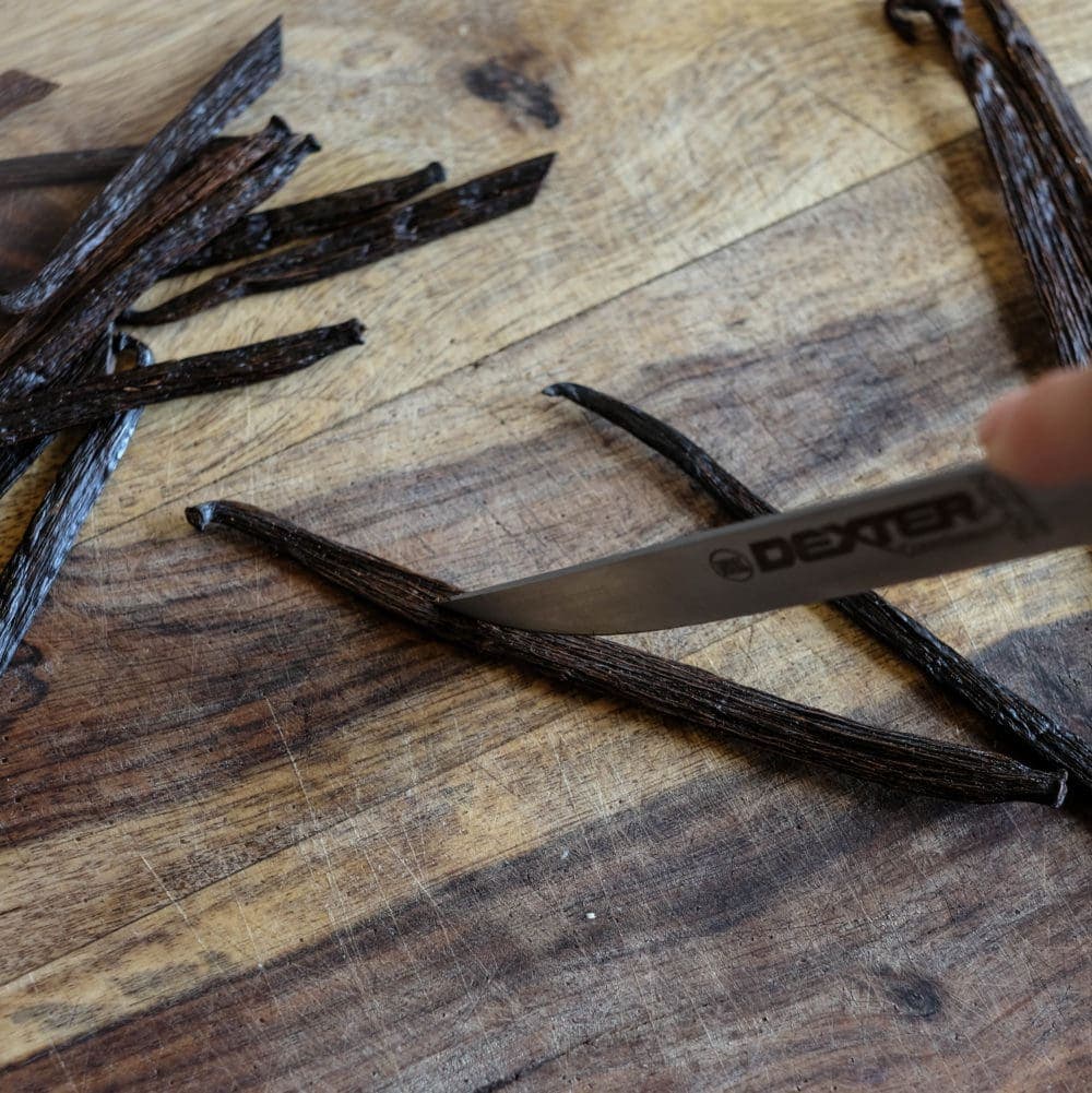 Cutting vanilla beans for homemade vanilla extract