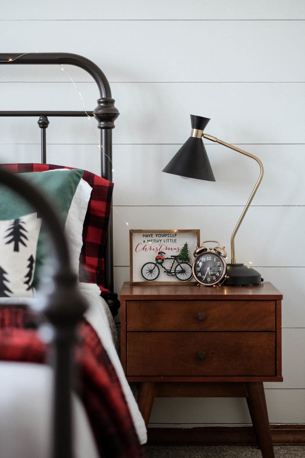 bedroom night stand with christmas twinkle lights 