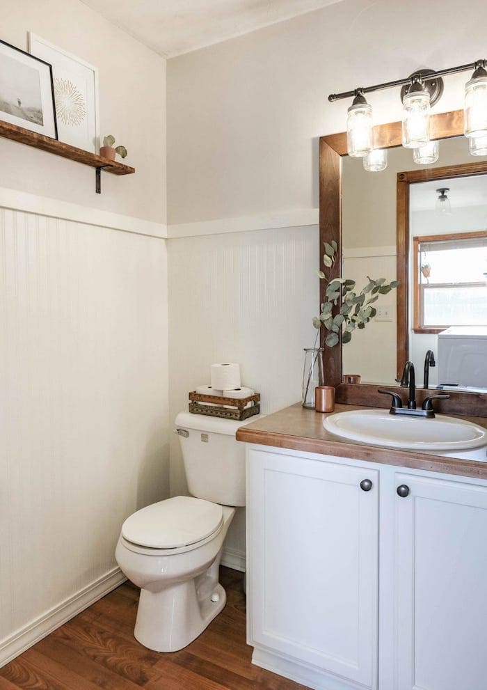 farmhouse bathroom with a painted vanity