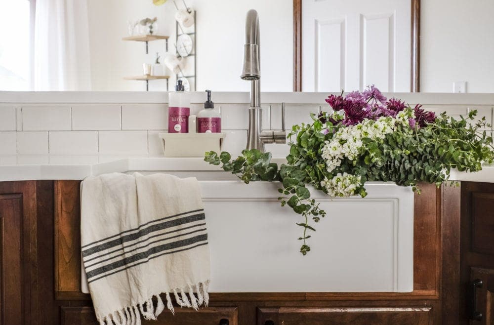 after picture for kitchen makeover with a white farmhouse sink and pull down faucit