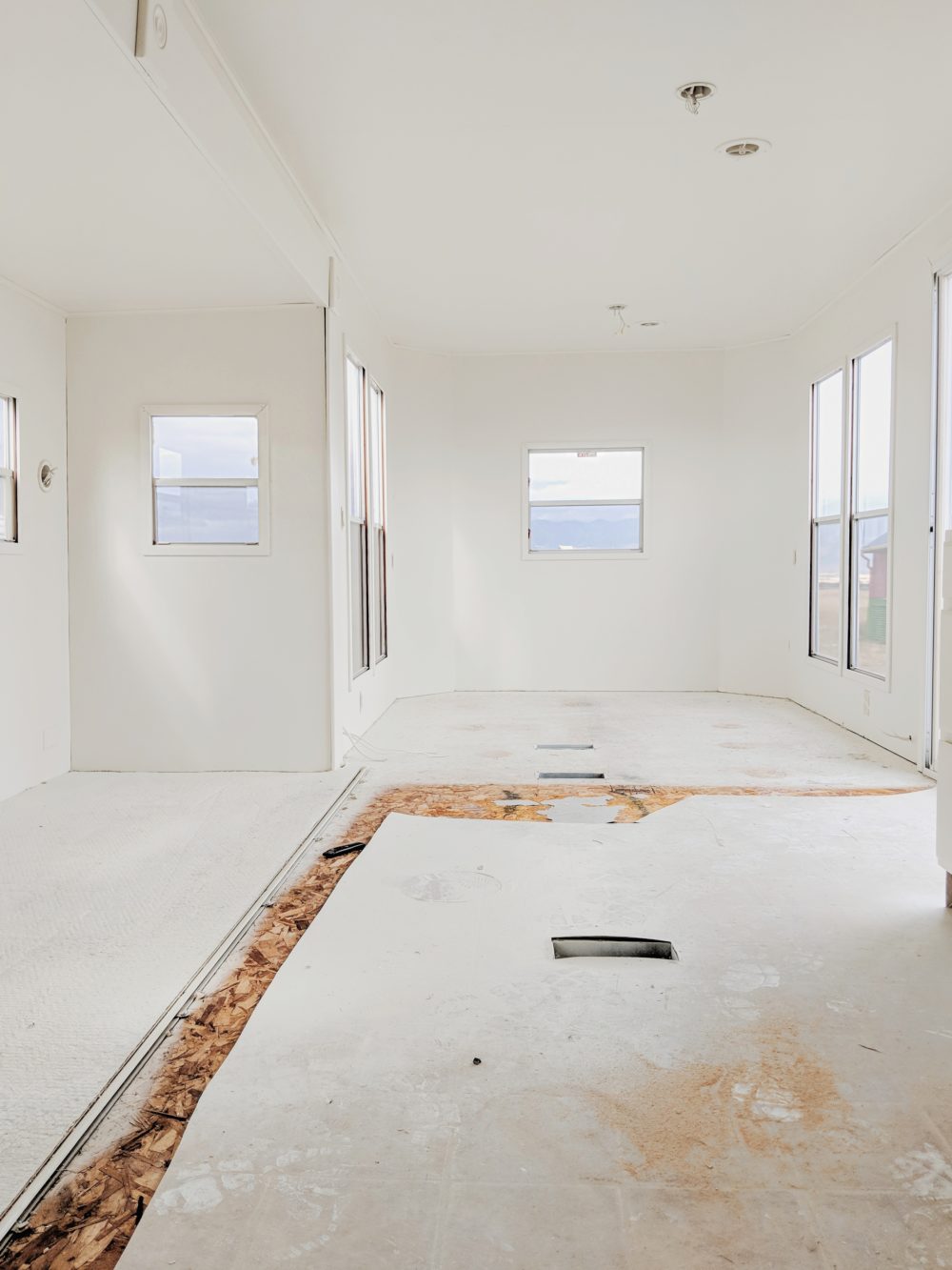 Interior of an RV during remodel painted in white