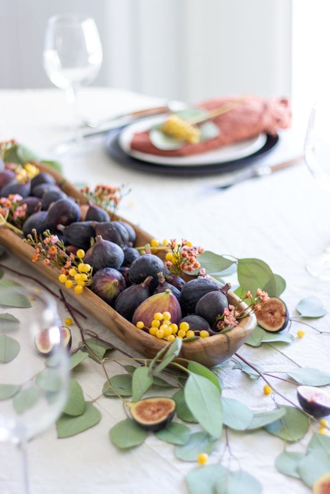 Thanksgiving table centerpieces with figs and a dough bowl