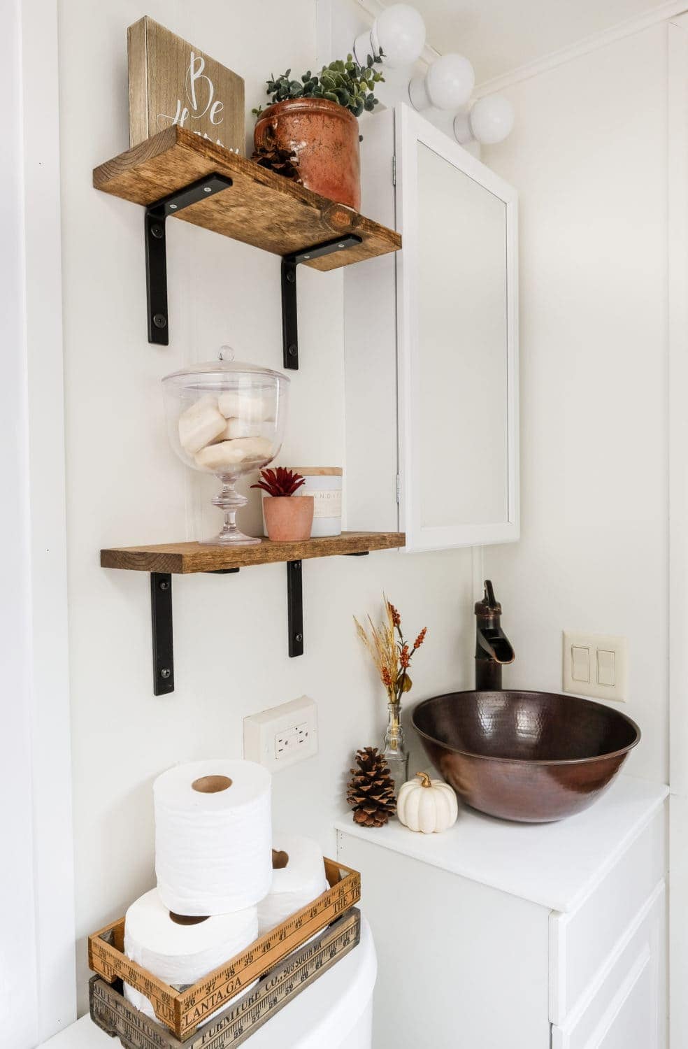 RV bathroom remodel with copper sink and open shelving