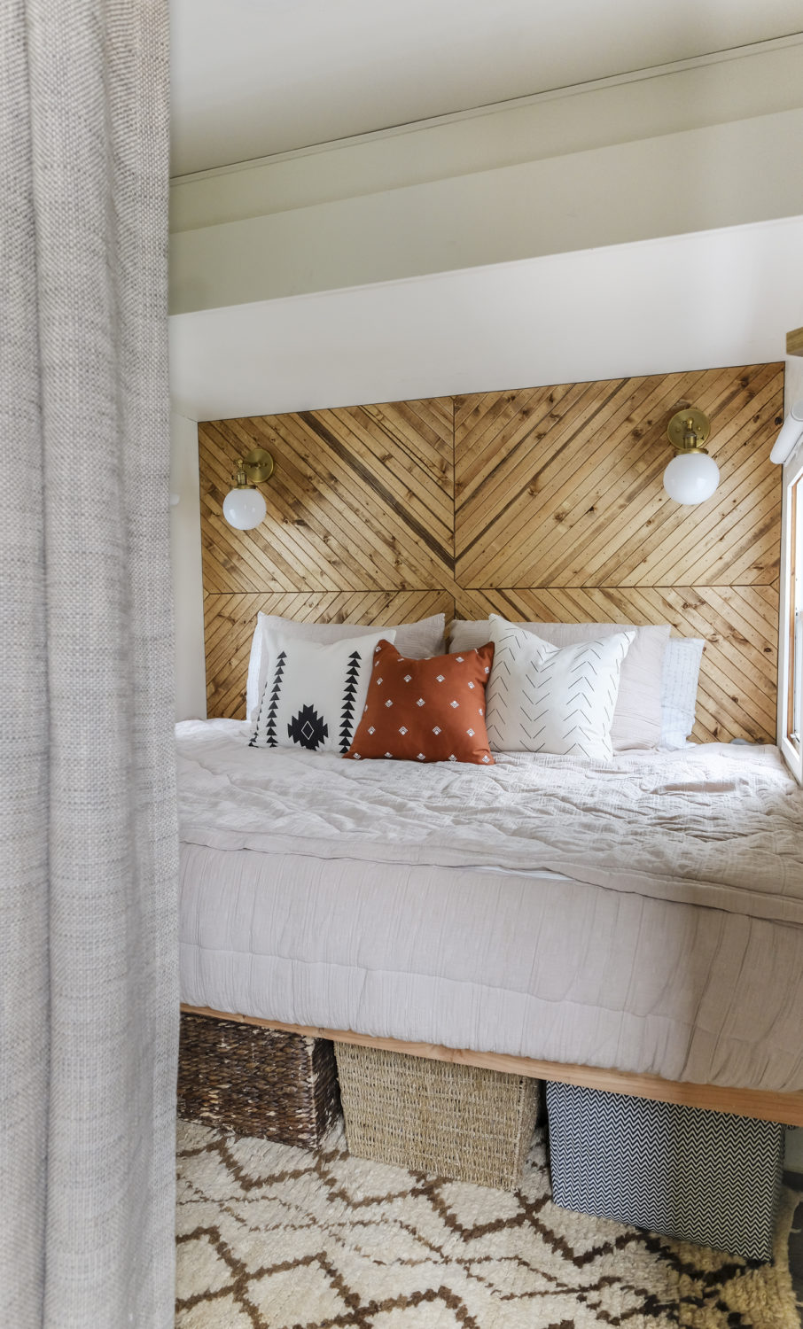 RV bedroom remodel with a wood accent wall