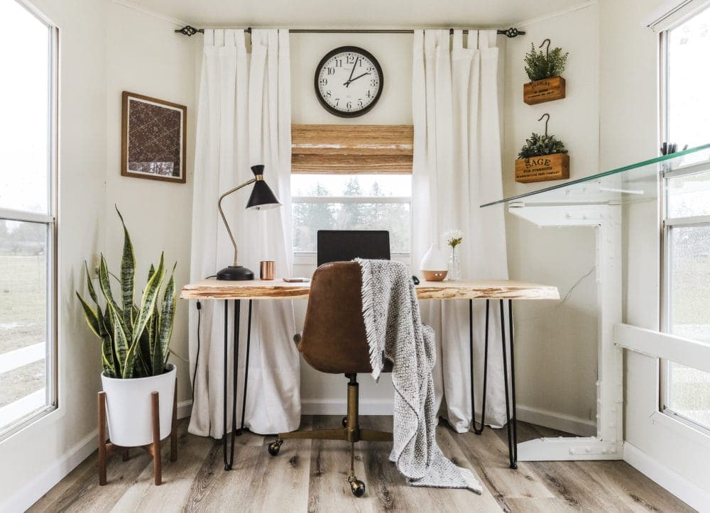 RV home office makeover with white walls, curtains and a wood desk