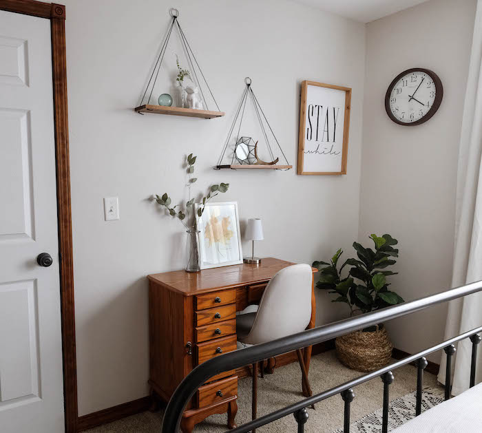 a bedroom painted gray with Pale Oak by Benjamin Moore