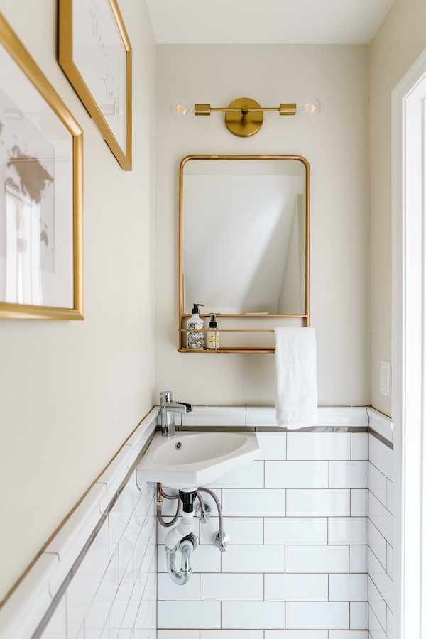 subway tile wainscoting in a bathroom