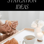 Woman enjoying tea and a croissant on her at-home staycation