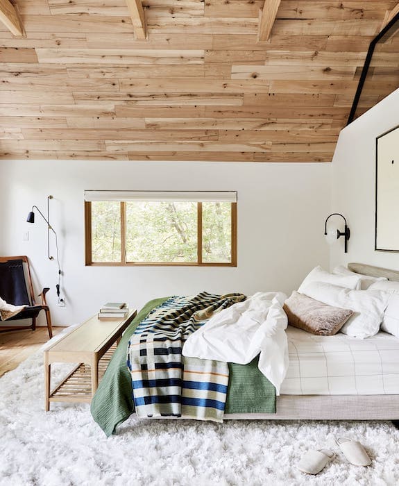 loft bedroom with luxurious bedding