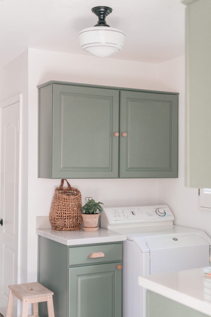 cabinets in a laundry room painted with Dried Thyme by Sherwin-Williams