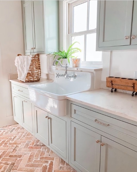 Kitchen cabinets painted with Sea Salt by Sherwin-Williams 