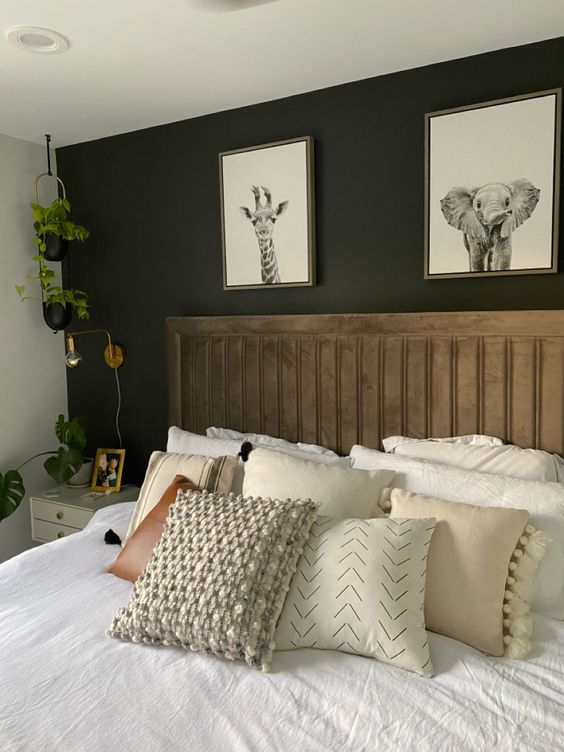 bedroom with accent wall behind the headboard painted with Iron Ore by Sherwin-Williams