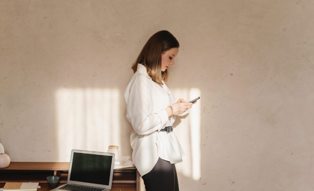 woman stands in room painted Most Popular Brown paint color