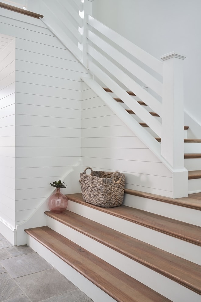 Shiplap on a staircase painted with Pure White by Sherwin-Williams